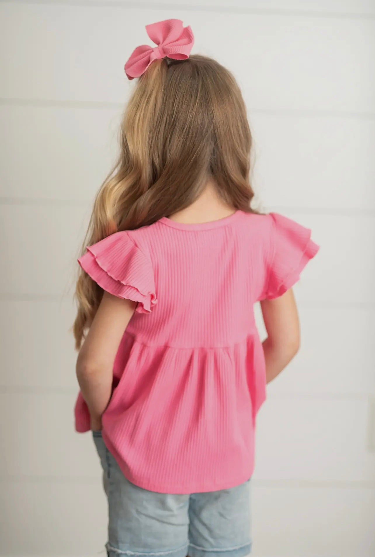 Pink peplum top